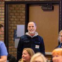 people standing at tables